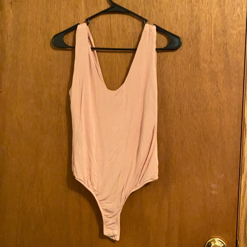 Nude colored body suit